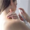 Kear Hydrate Relax Natural Body Oil - Woman applying oil to neck