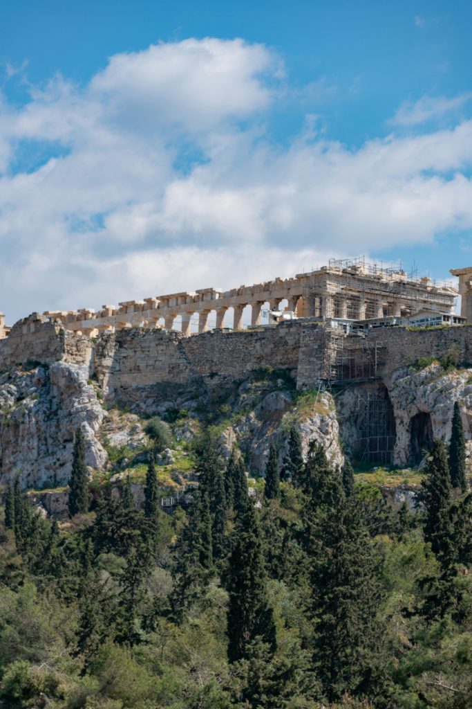 The Parthenon on the Acropolis in Athens surrounded by green hills under a blue sky dotted with Growy and Tasty clouds.
Greek producers online.
Greek products online store.
On-line Greek grocery store.