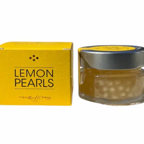 Pot de 50 ml de perles de vinaigre balsamique au citron Messino, à côté de sa boîte jaune