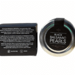 Top view of the Messino balsamic vinegar pearl jar with its black box