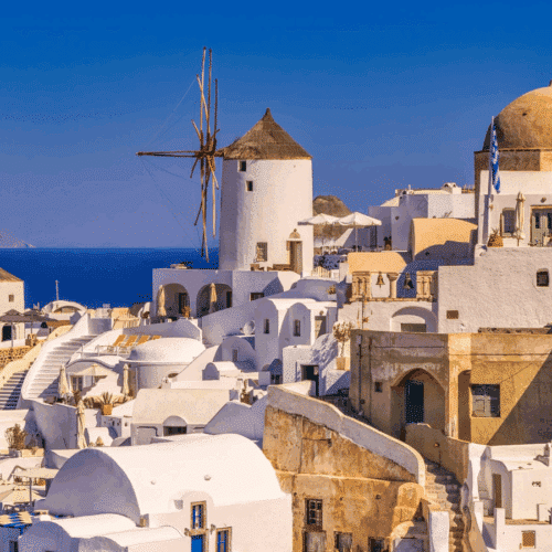 Emblematic view of Santorini with windmills and white houses overlooking the Aegean Sea