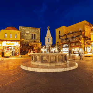 Rhodes Old Town by night - lively square and medieval fountain