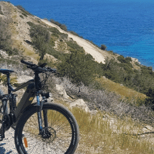 E-bike tour of Greece's coastal roads overlooking the turquoise sea.