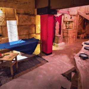 Reconstructed winemakers' hall in Athens for an ancient oenological experience, complete with tasting tables and accessories.