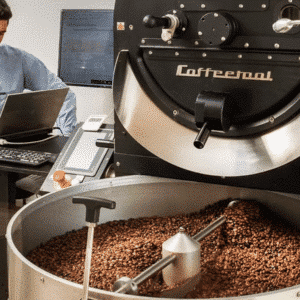 Visit a coffee roasting plant in Aegina, with an operator in front of a professional coffee roaster.